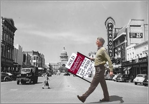Tom Polk walking with SOLD sign